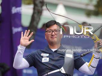 Kim Woojin of Korea competes against Lee Woo Seok of Korea (not in picture) during the Men's recurve final match on the final day of the Tla...