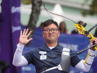 Kim Woojin of Korea competes against Lee Woo Seok of Korea (not in picture) during the Men's recurve final match on the final day of the Tla...