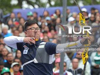 Kim Woojin of Korea competes against Lee Woo Seok of Korea (not in picture) during the Men's recurve final match on the final day of the Tla...