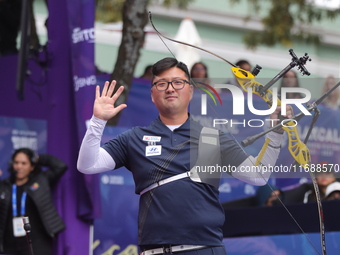 Kim Woojin of Korea competes against Lee Woo Seok of Korea (not in picture) during the Men's recurve final match on the final day of the Tla...