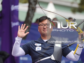 Kim Woojin of Korea competes against Lee Woo Seok of Korea (not in picture) during the Men's recurve final match on the final day of the Tla...