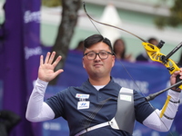 Kim Woojin of Korea competes against Lee Woo Seok of Korea (not in picture) during the Men's recurve final match on the final day of the Tla...