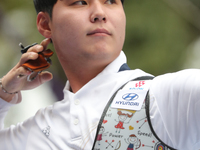 Lee Woo Seok of Korea competes against Kim Woojin of Korea (not in picture) during the Men's recurve final match on the final day of the Tla...