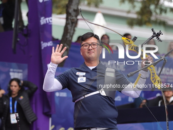 Kim Woojin of Korea competes against Lee Woo Seok of Korea (not in picture) during the Men's recurve final match on the final day of the Tla...