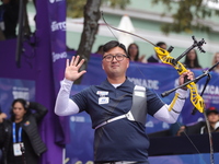 Kim Woojin of Korea competes against Lee Woo Seok of Korea (not in picture) during the Men's recurve final match on the final day of the Tla...