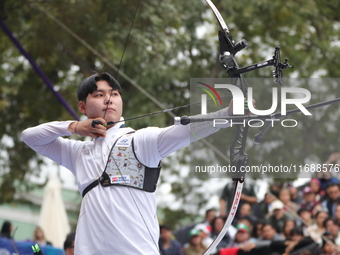 Lee Woo Seok of Korea competes against Kim Woojin of Korea (not in picture) during the Men's recurve final match on the final day of the Tla...