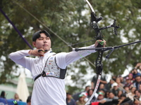 Lee Woo Seok of Korea competes against Kim Woojin of Korea (not in picture) during the Men's recurve final match on the final day of the Tla...