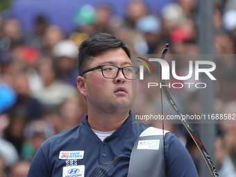 Kim Woojin of Korea competes against Lee Woo Seok of Korea (not in picture) during the Men's recurve final match on the final day of the Tla...