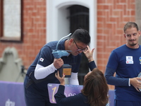 Gold medalist winner Kim Woojin of Korea receives the first place prize during the medal ceremony on the final day of the Tlaxcala 2024 Arch...