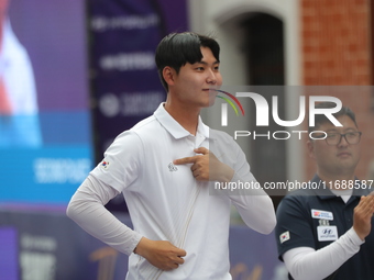 Silver medalist Lee Woo Seok of Korea receives the second-place prize during the medal ceremony on the final day of the Tlaxcala 2024 Archer...