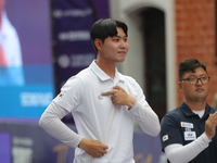 Silver medalist Lee Woo Seok of Korea receives the second-place prize during the medal ceremony on the final day of the Tlaxcala 2024 Archer...