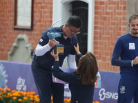 Gold medalist Kim Woojin of Korea receives the first place prize during the medal ceremony on the final day of the Tlaxcala 2024 Archery Wor...