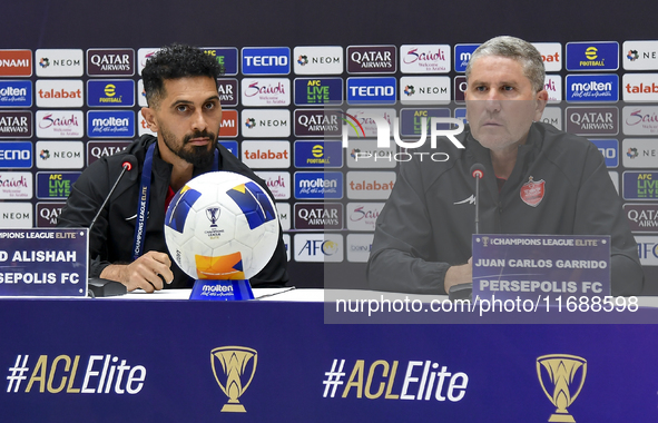 Head Coach of Persepolis FC Juan Carlos Fernandez (R) and player Omid Alishah (L) attend the press conference at Jassim Bin Hamad Stadium in...