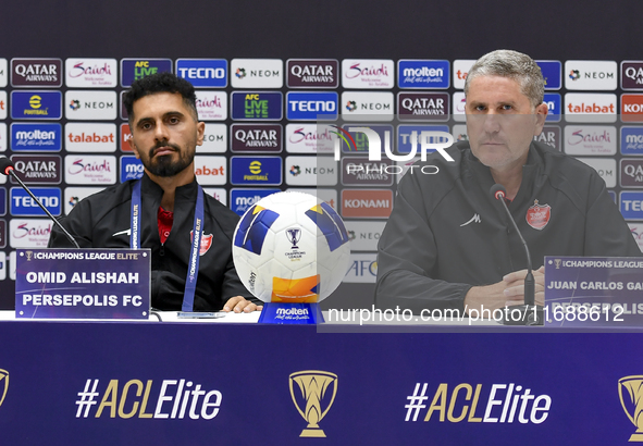 Head Coach of Persepolis FC Juan Carlos Fernandez (R) and player Omid Alishah (L) attend the press conference at Jassim Bin Hamad Stadium in...