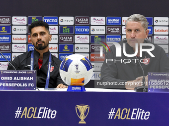 Head Coach of Persepolis FC Juan Carlos Fernandez (R) and player Omid Alishah (L) attend the press conference at Jassim Bin Hamad Stadium in...