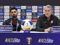 Head Coach of Persepolis FC Juan Carlos Fernandez (R) and player Omid Alishah (L) attend the press conference at Jassim Bin Hamad Stadium in...