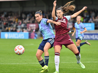 Mariona Caldentey (8 Arsenal) and Seraina Piubel (77 West Ham) battle for the ball during the Barclays FA Women's Super League match between...