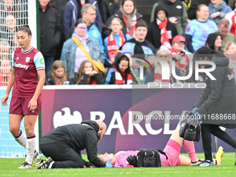 Goalkeeper Kinga Szemik of West Ham receives medical treatment during the Barclays FA Women's Super League match between West Ham United and...