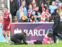 Goalkeeper Kinga Szemik of West Ham receives medical treatment during the Barclays FA Women's Super League match between West Ham United and...