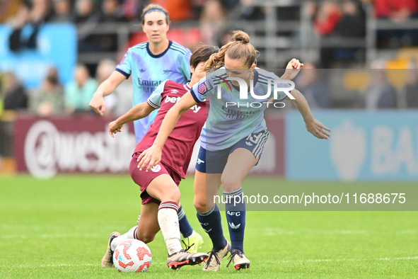 Lia Walti (13 Arsenal) is challenged by Riko Ueki (9 West Ham) during the Barclays FA Women's Super League match between West Ham United and...