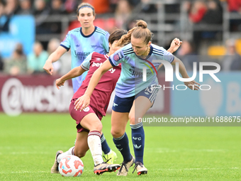 Lia Walti (13 Arsenal) is challenged by Riko Ueki (9 West Ham) during the Barclays FA Women's Super League match between West Ham United and...