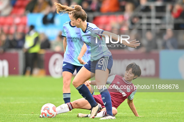 Lia Walti (13 Arsenal) is challenged by Riko Ueki (9 West Ham) during the Barclays FA Women's Super League match between West Ham United and...