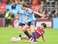 Lia Walti (13 Arsenal) is challenged by Riko Ueki (9 West Ham) during the Barclays FA Women's Super League match between West Ham United and...