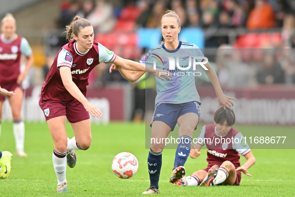 Emma Harris (12 West Ham) challenges Lia Walti (13 Arsenal) during the Barclays FA Women's Super League match between West Ham United and Ar...