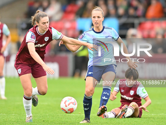 Emma Harris (12 West Ham) challenges Lia Walti (13 Arsenal) during the Barclays FA Women's Super League match between West Ham United and Ar...