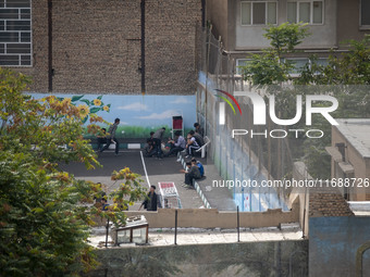 Iranian students appear at a high school in the historical city of Tabriz, Iran, on October 16, 2024, amid global concerns about war between...