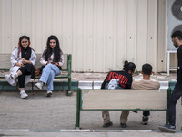 Two young Iranian women sit together in the historical city of Tabriz, located 624 km (388 miles) northwest of Tehran in the Eastern Azerbai...