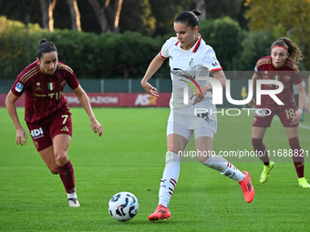 Evelyne Viens of A.S. Roma Femminile, Monica Renzotti of A.C. Milan Femminile, and Benedetta Glionna of A.S. Roma Femminile are in action du...