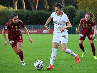 Evelyne Viens of A.S. Roma Femminile, Monica Renzotti of A.C. Milan Femminile, and Benedetta Glionna of A.S. Roma Femminile are in action du...