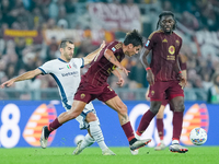 Paulo Dybala of AS Roma and Henrikh Mkhitaryan of FC Internazionale compete for the ball during the Serie A Enilive match between AS Roma an...