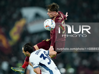 Nicola Zalewski of AS Roma and Matteo Darmian of FC Internazionale jump for the ball during the Serie A Enilive match between AS Roma and FC...