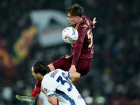 Nicola Zalewski of AS Roma and Matteo Darmian of FC Internazionale jump for the ball during the Serie A Enilive match between AS Roma and FC...