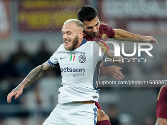 Federico Dimarco of FC Internazionale and Zeki Celik of AS Roma jump for the ball during the Serie A Enilive match between AS Roma and FC In...