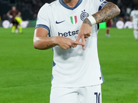 Lautaro Martinez of FC Internazionale celebrates after scoring first goal during the Serie A Enilive match between AS Roma and FC Internazio...