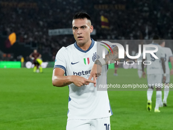 Lautaro Martinez of FC Internazionale celebrates after scoring first goal during the Serie A Enilive match between AS Roma and FC Internazio...