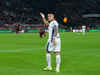 Lautaro Martinez of FC Internazionale celebrates after scoring first goal during the Serie A Enilive match between AS Roma and FC Internazio...