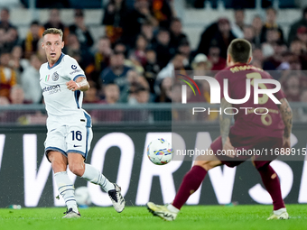 Davide Frattesi of FC Internazionale and Angelino of AS Roma during the Serie A Enilive match between AS Roma and FC Internazionale at Stadi...