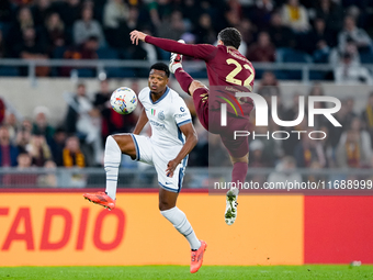 Denzel Dumfries of FC Internazionale and Mario Hermoso of AS Roma compete for the ball during the Serie A Enilive match between AS Roma and...