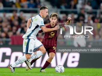 Tommaso Baldanzi of AS Roma and Davide Frattesi of FC Internazionale compete for the ball during the Serie A Enilive match between AS Roma a...