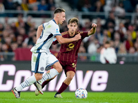 Tommaso Baldanzi of AS Roma and Davide Frattesi of FC Internazionale compete for the ball during the Serie A Enilive match between AS Roma a...