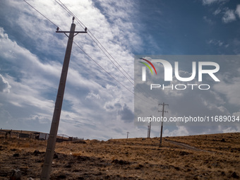 Electric poles are pictured on a road in a suburb of the historical city of Tabriz, located 624 km (388 miles) northwest of Tehran in the Ea...