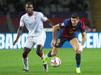 Robert Lewandowski and Lucien Agoume play during the match between FC Barcelona and Sevilla FC, corresponding to week 10 of LaLiga EA Sports...