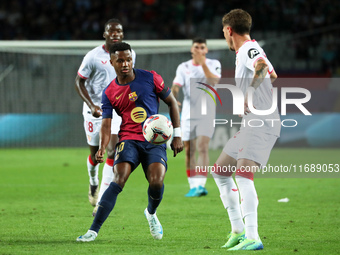 Ansu Fati plays during the match between FC Barcelona and Sevilla FC, corresponding to week 10 of LaLiga EA Sports, at the Lluis Companys St...