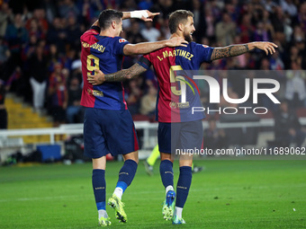 Inigo Martinez and Robert Lewandowski celebrate during the match between FC Barcelona and Sevilla FC, corresponding to week 10 of LaLiga EA...