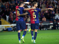 Inigo Martinez and Robert Lewandowski celebrate during the match between FC Barcelona and Sevilla FC, corresponding to week 10 of LaLiga EA...