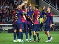 FC Barcelona players celebrate during the match between FC Barcelona and Sevilla FC, corresponding to week 10 of LaLiga EA Sports, at the Ll...